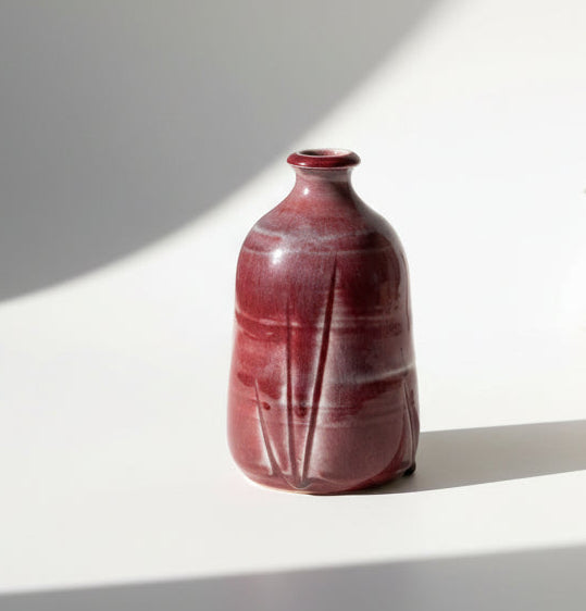 Beautiful small studio pottery vase with a rich deep red / oxblood glaze.